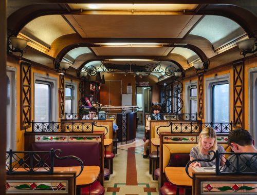 Siberia, Russia - July 21, 2017: Passengers in the restaurant car onboard the Trans-Siberian Railway in Siberia, Russia.